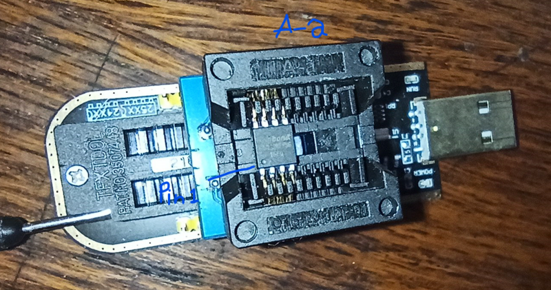 File:Picture of ch341a with a bios chip inside of it.png